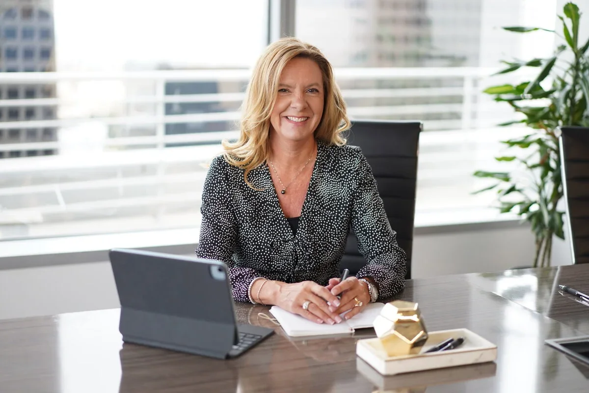 Anita S. Henry at her desk, leadership coach and consultant