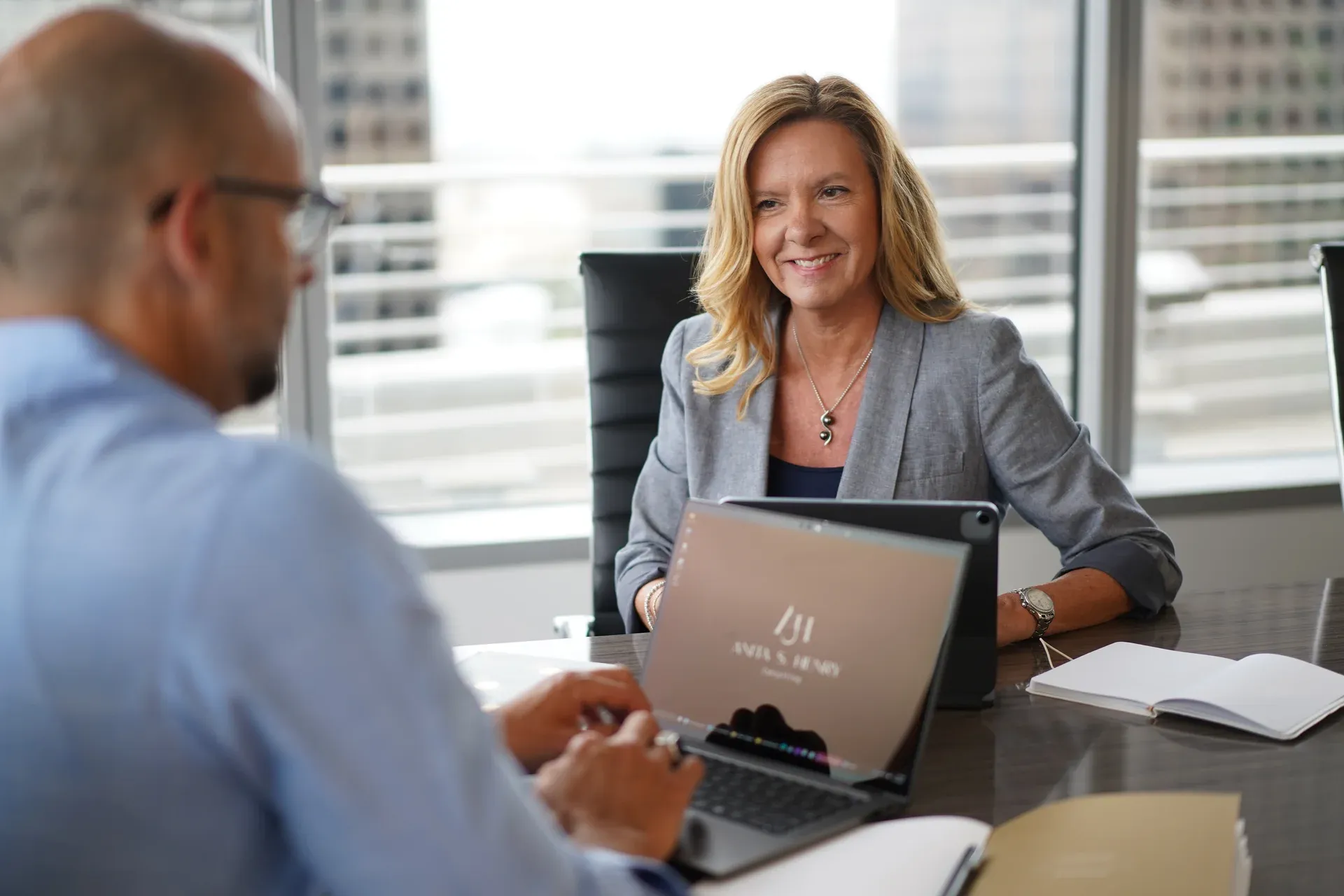 Anita Henry consulting with client at desk